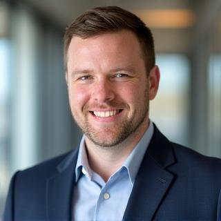 Professional headshot of Ben Carter.